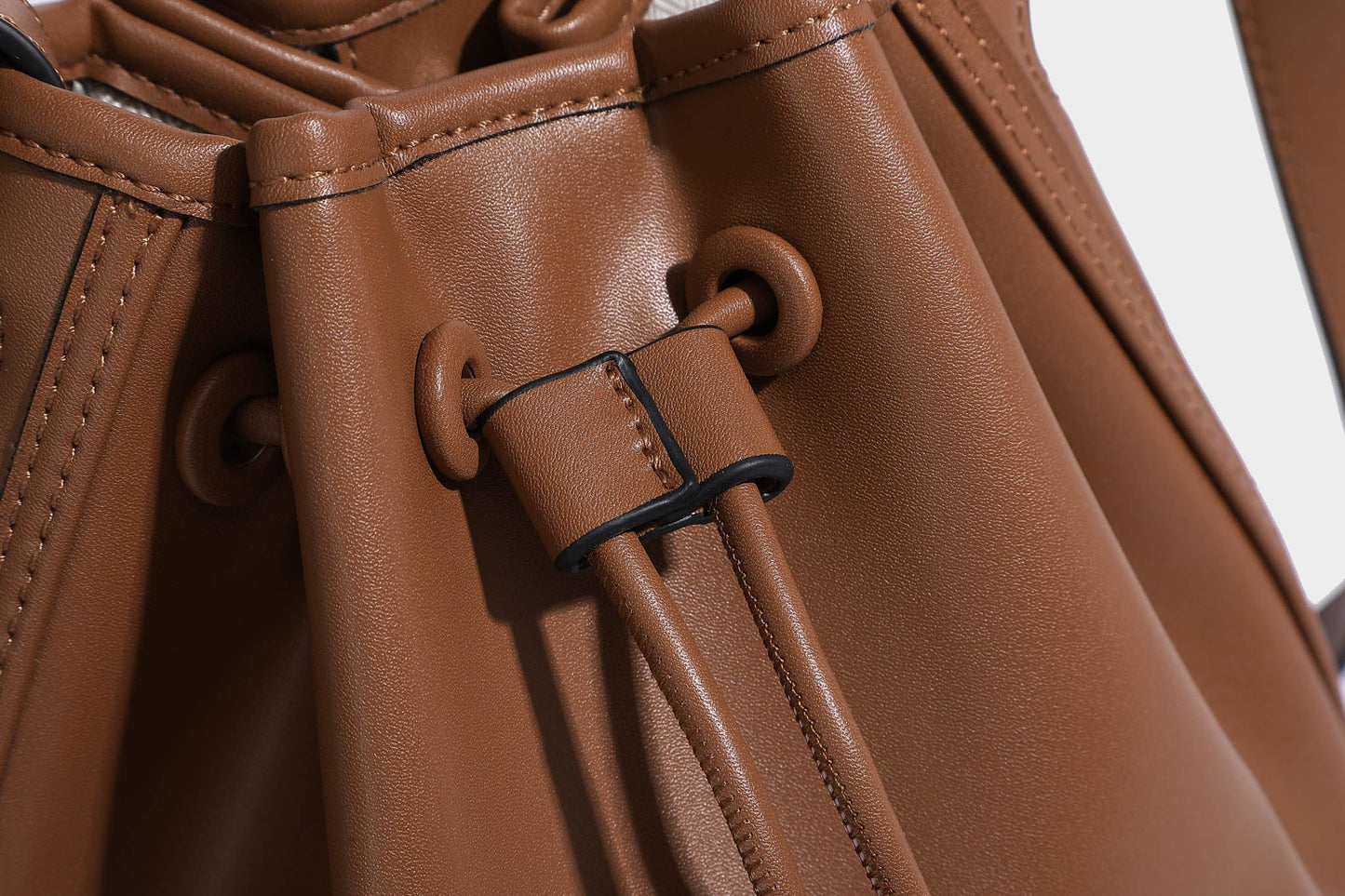 TEALA COMPACT BUCKET BAG