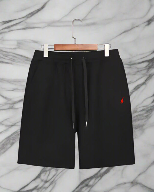 Black shorts with a red logo on a white background