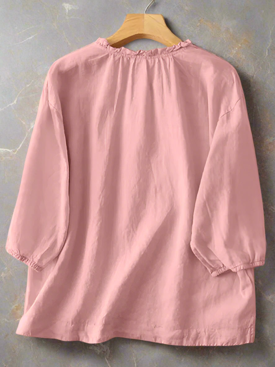 Pink dress on a hanger with ZANZEA branding.